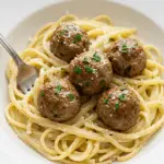 Garlic Butter Meatballs over Creamy Parmesan Linguine