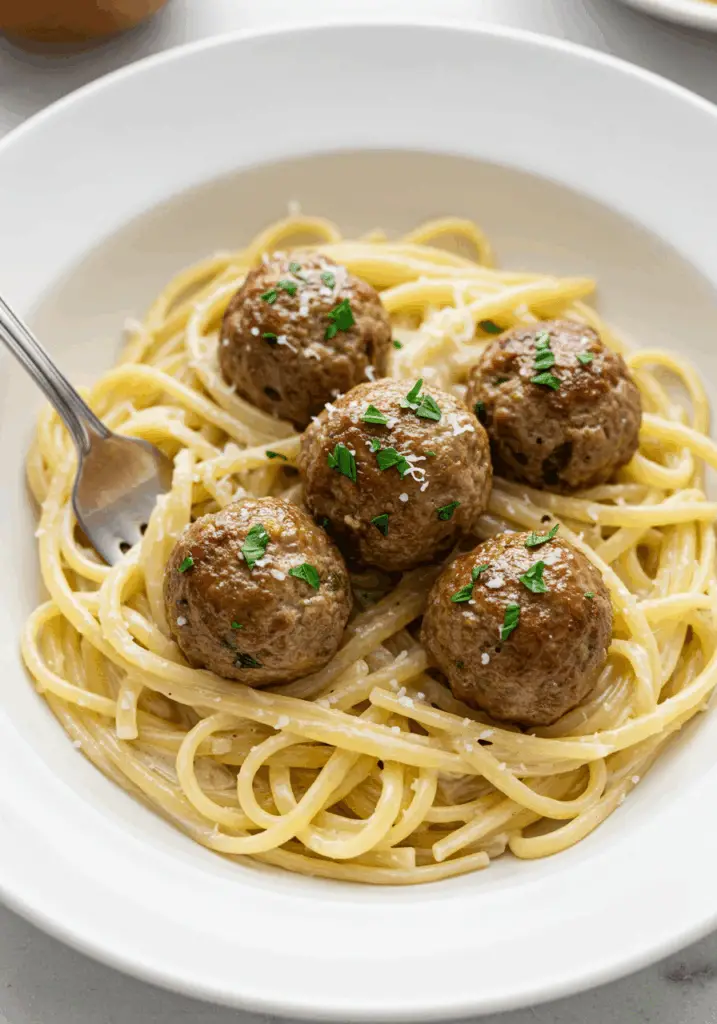Garlic Butter Meatballs over Creamy Parmesan Linguine