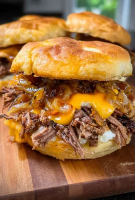 Crockpot Shredded Beef and Cheddar Sandwiches