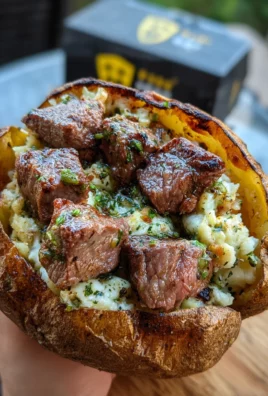Grilled Steak Bite Loaded Baked Potatoes with Garlic Herb Butter